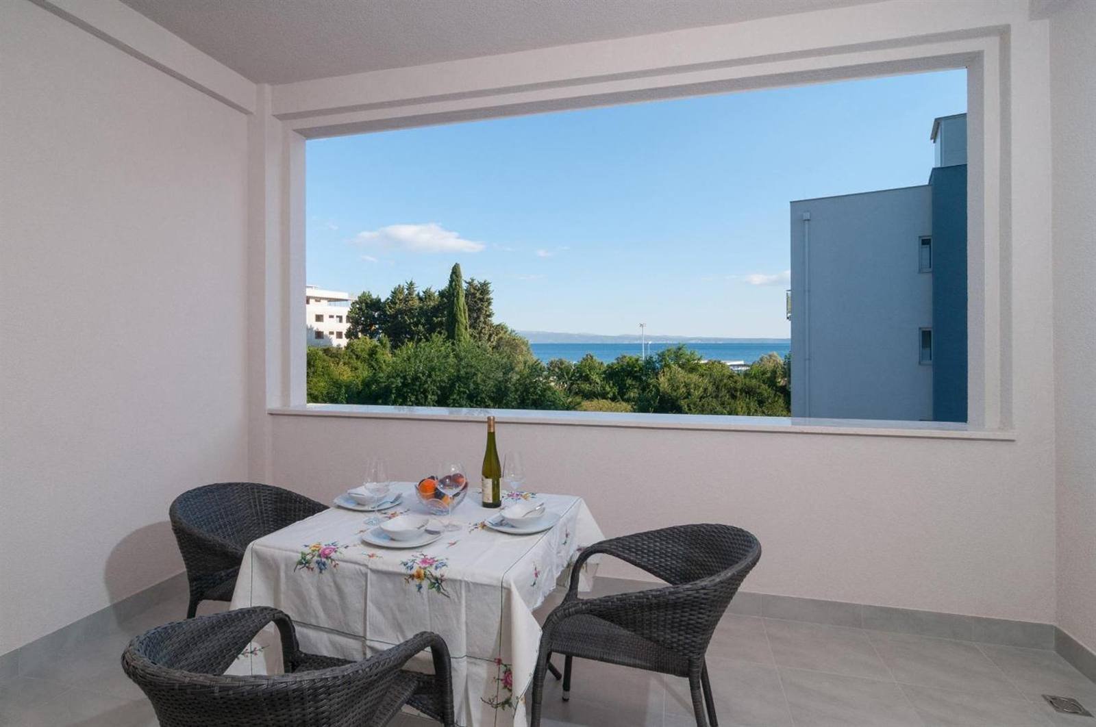 Dining corner with a large picture window and a view of the sea